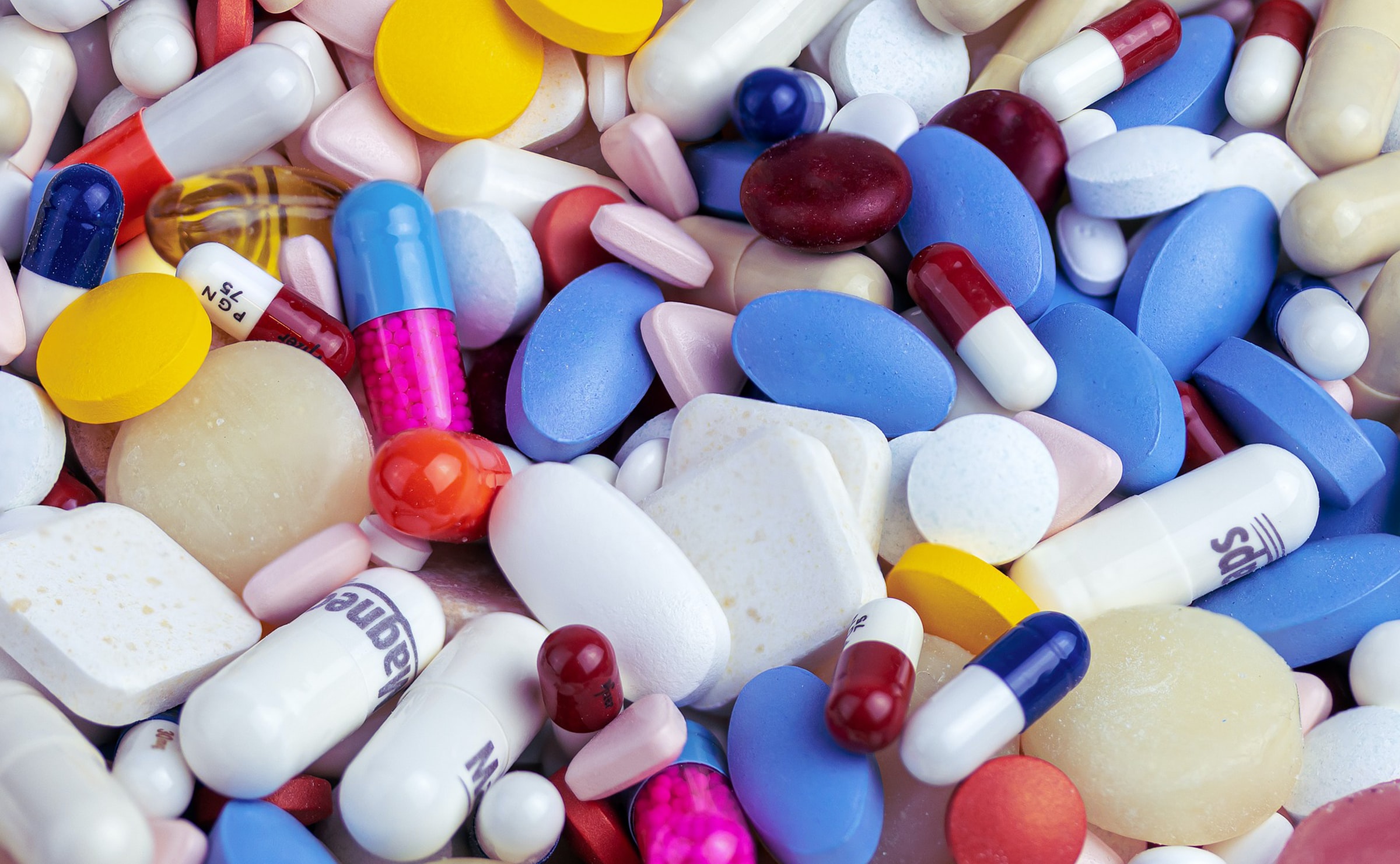 Various pills; capsules, tablets, and lozenges in various colors and shapes